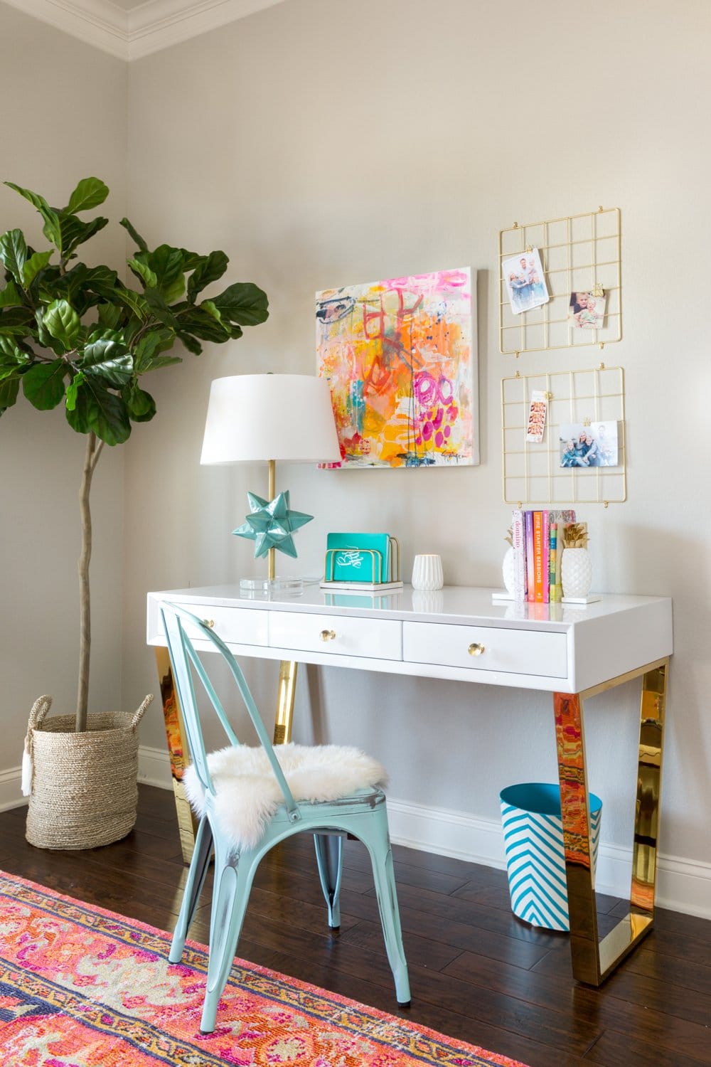 A colorful home office with original abstract art