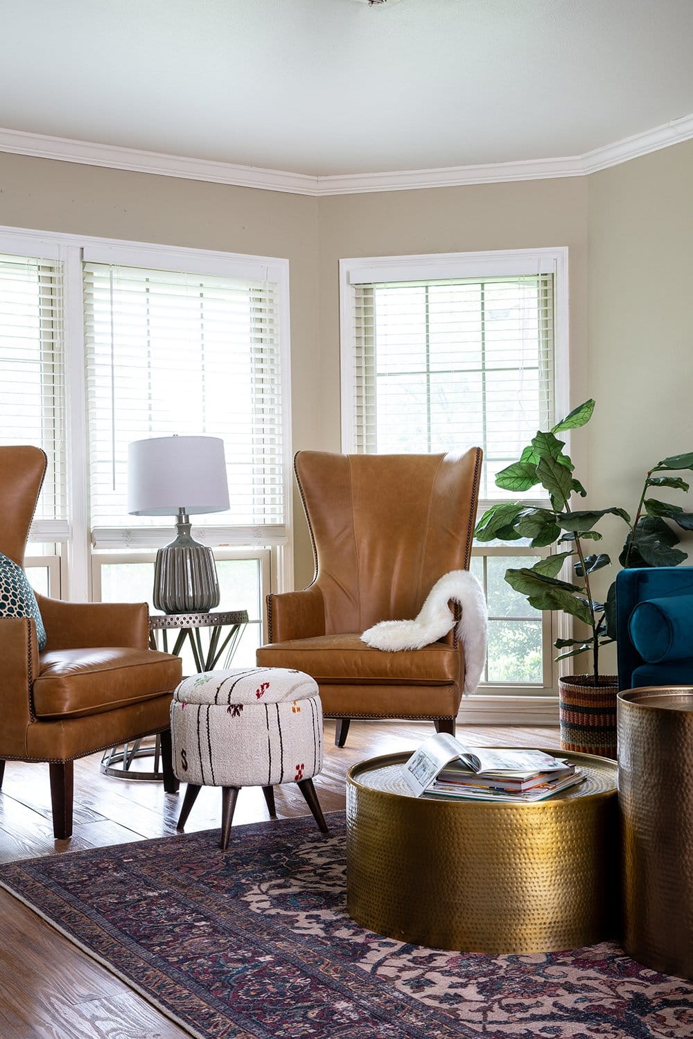 Before and After: A Family-Friendly Texas Living Room with Leather Accent Chairs by interior designer Lesley Myrick