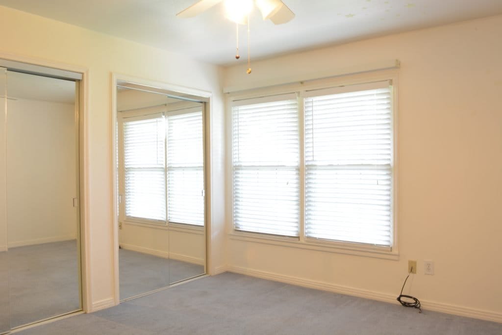 This boring white bedroom was transformed into a stunning home office by interior designer Lesley Myrick