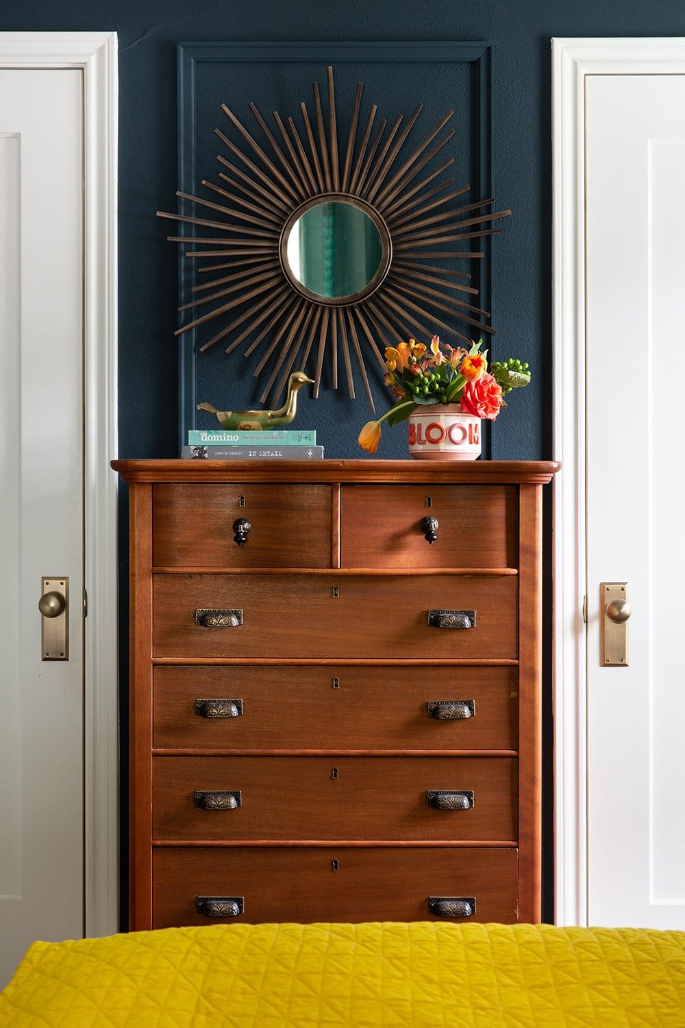 Love this before and after of a bedroom with navy walls by interior designer Lesley Myrick