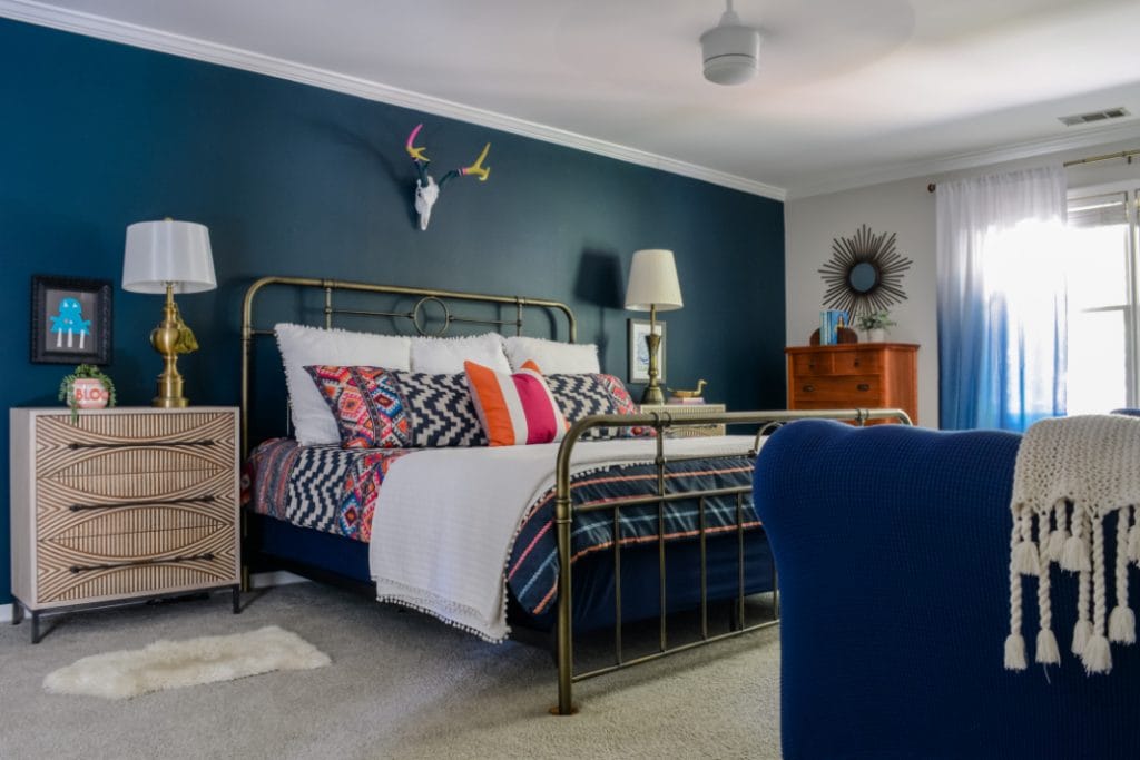 Love the navy accent wall in this bedroom! It's Sherwin-Williams Dark Night. 