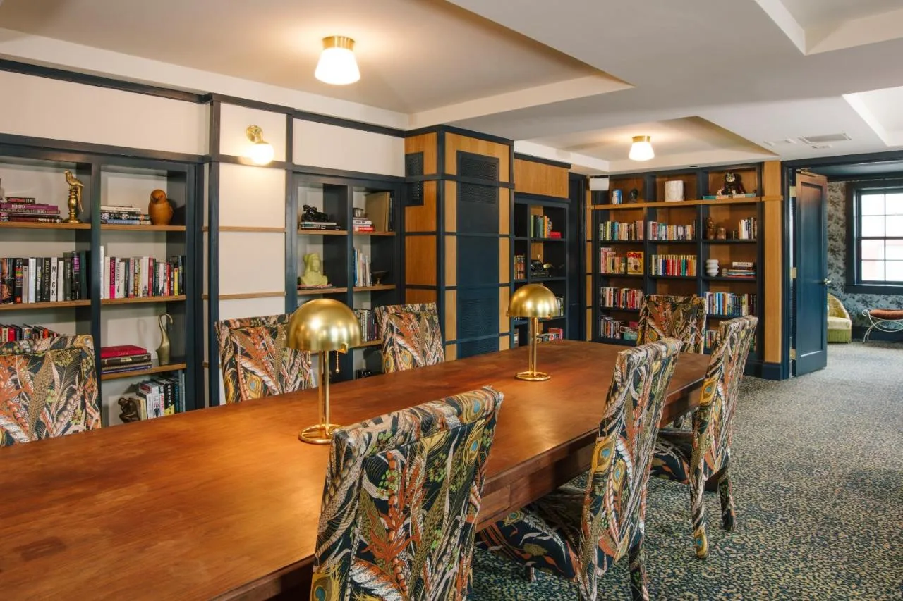 A cozy library at The New Yorker, featuring boutique hotel-inspired decor in the Hotel Cleremont, Atlanta.