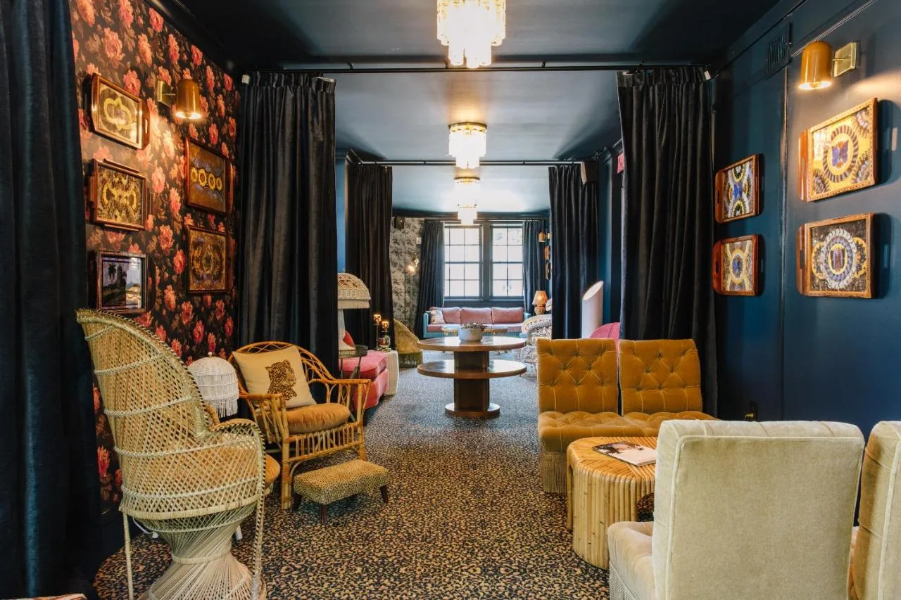 Colorful furniture adorns the hotel's lobby, creating a vibrant and inviting atmosphere at Hotel Cleremont, Atlanta.