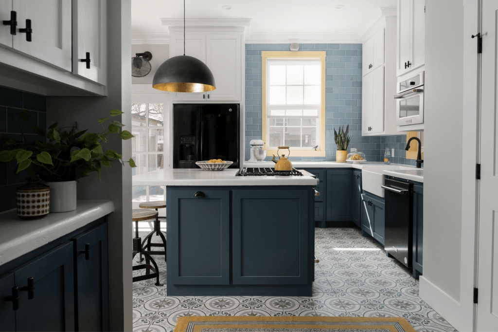 A fresh blue and white kitchen with an oversize island and coffee bar