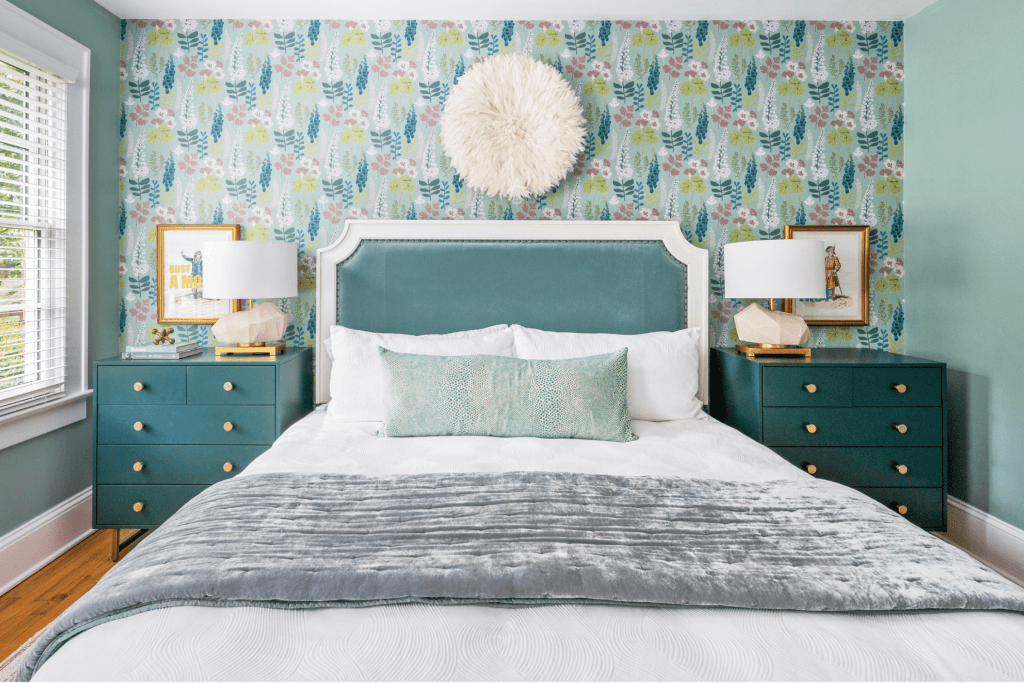 The floral wallpaper in this teal bedroom design by Macon interior designer Lesley Myrick is a showstopper! 