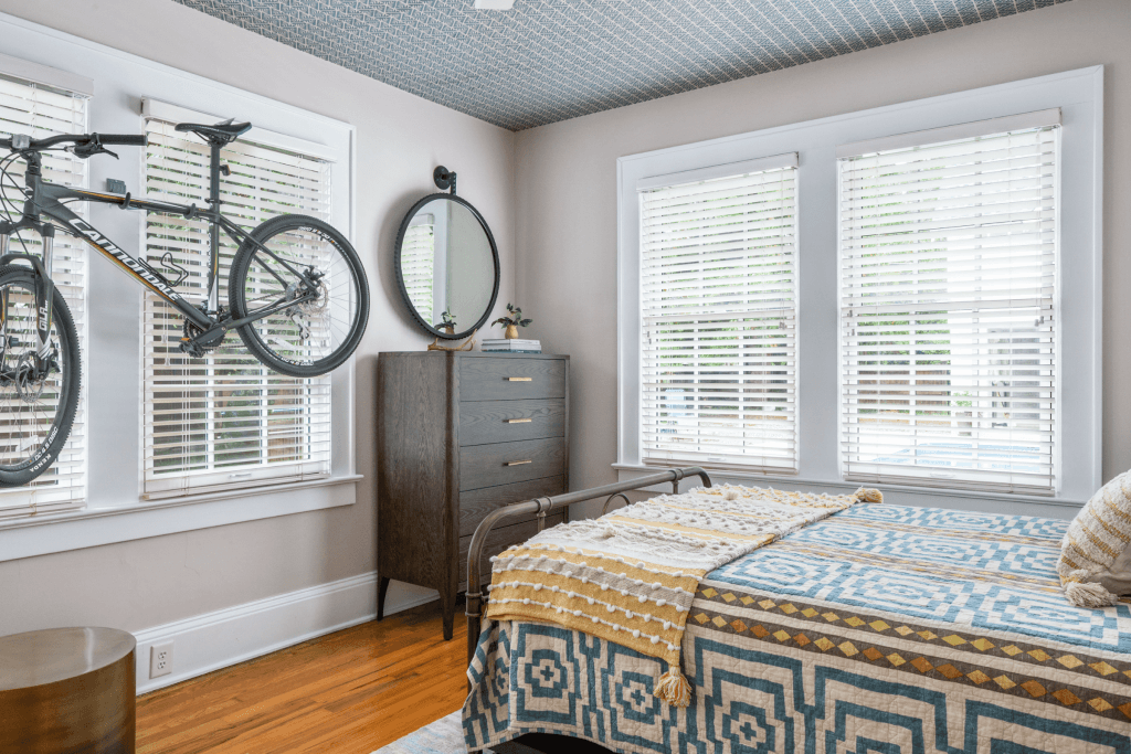 A wallpapered ceiling steals the show in this Macon, GA interior design by Lesley Myrick