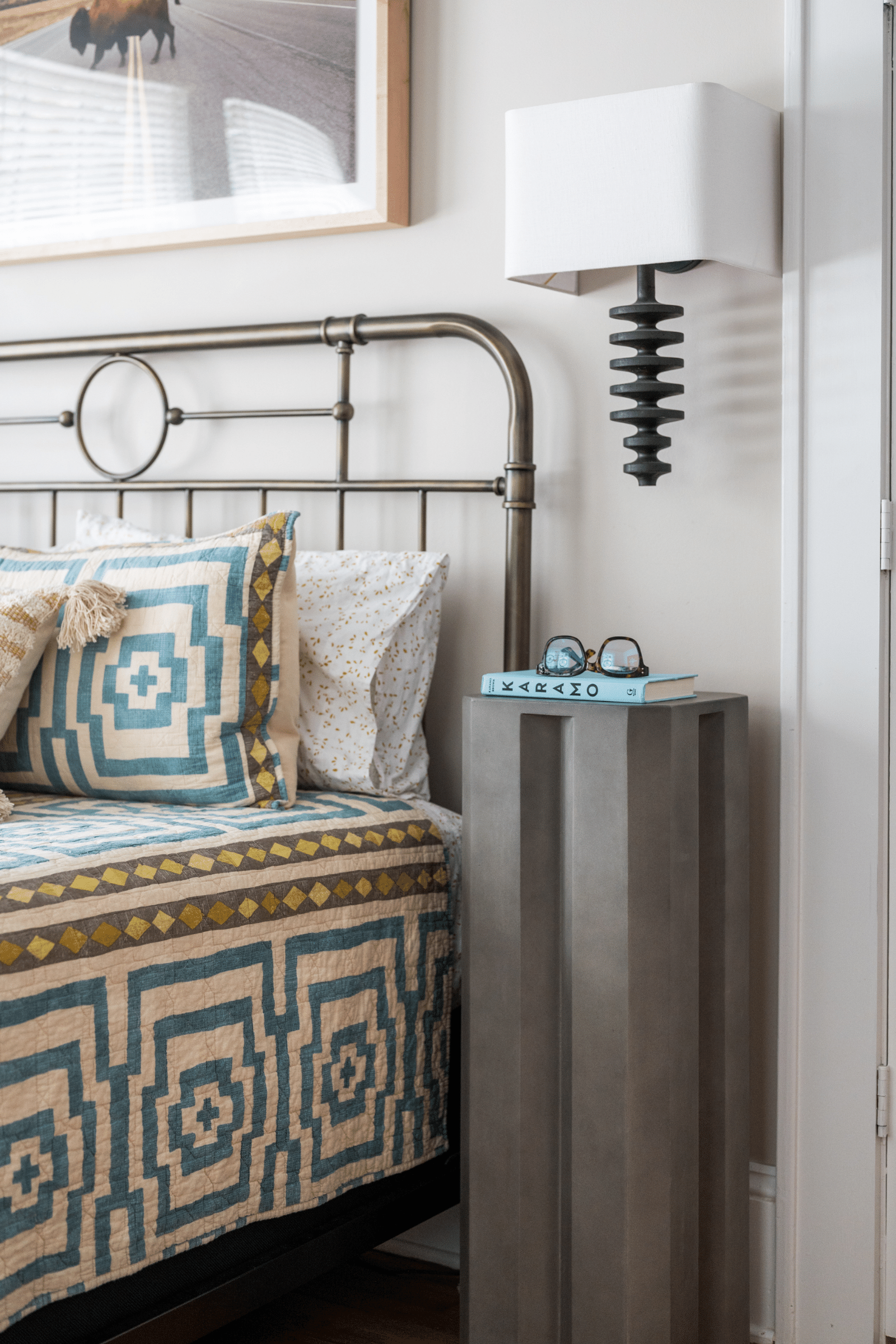 Fishbone sconces create a sculptural statement in this bedroom by Atlanta luxury interior designer Lesley Myrick