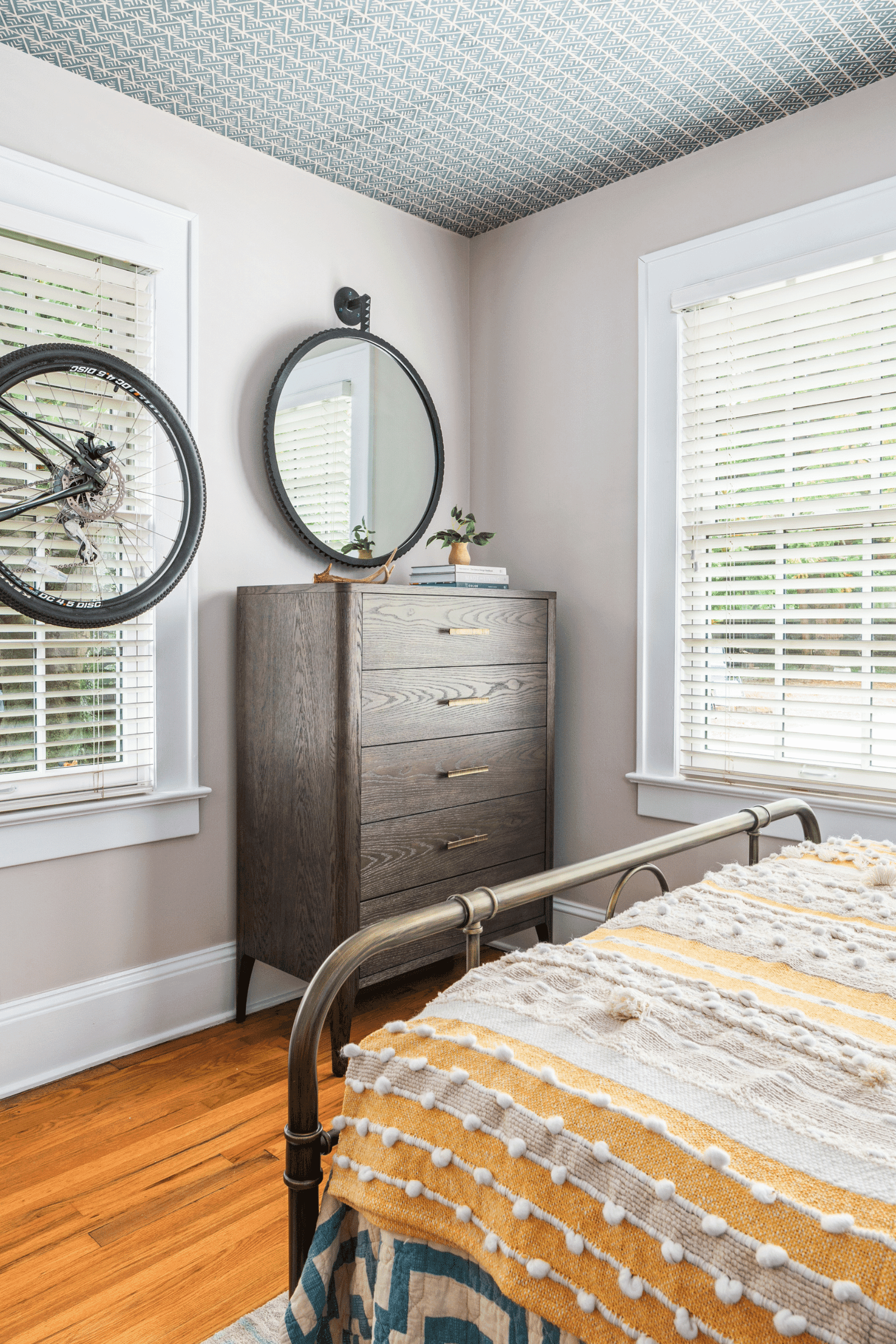 A wallpapered ceiling steals the show in this Macon, GA interior design by Lesley Myrick