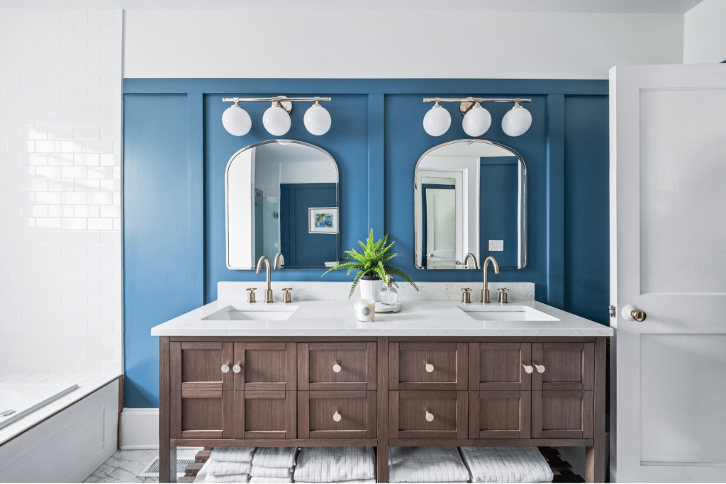 A high-end coastal-inspired blue primary bathroom in Macon, GA, designed by Lesley Myrick Interior Design