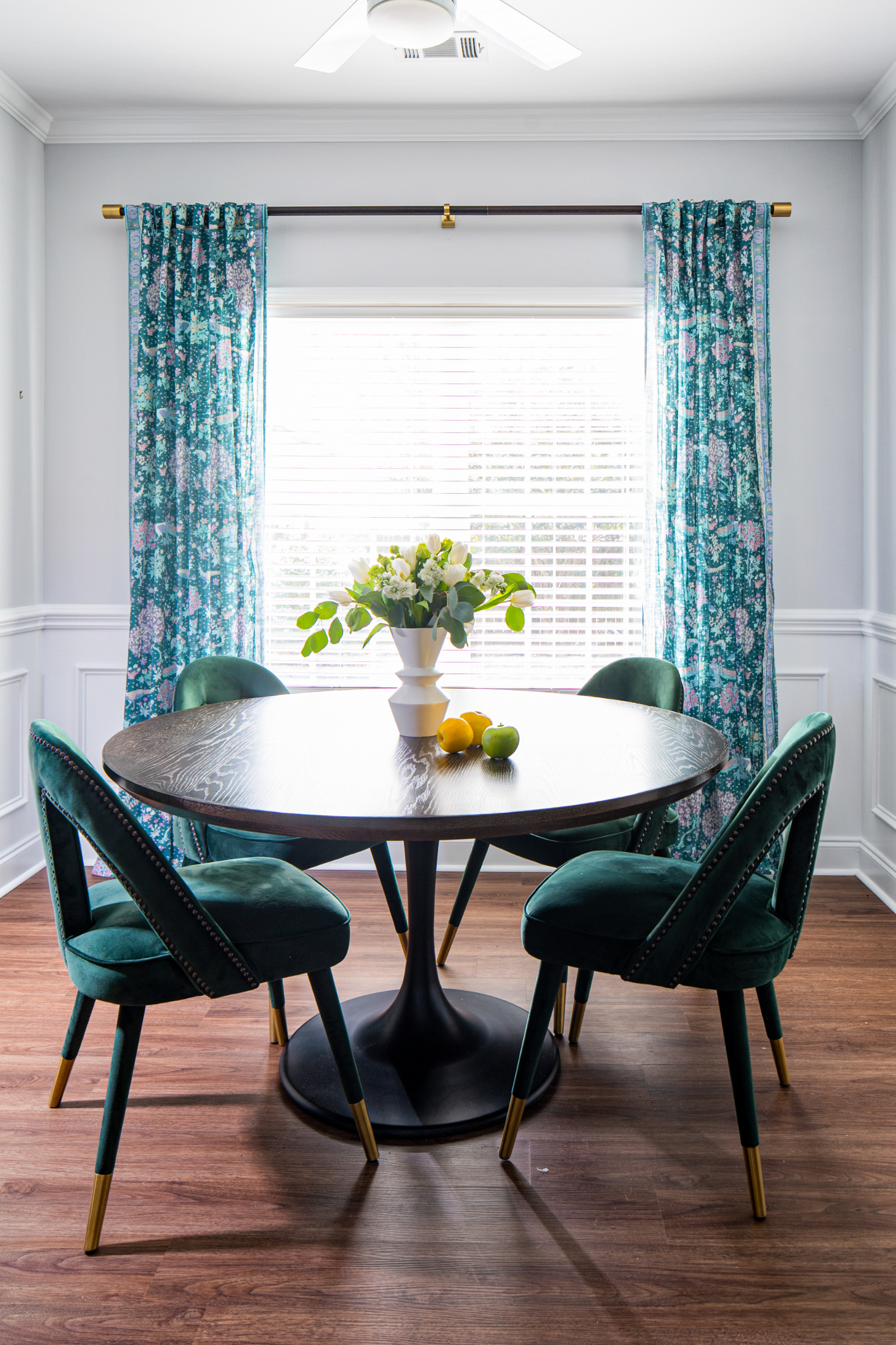 A blue and green dining room designed by Atlanta luxury designer Lesley Myrick Interior Design.
