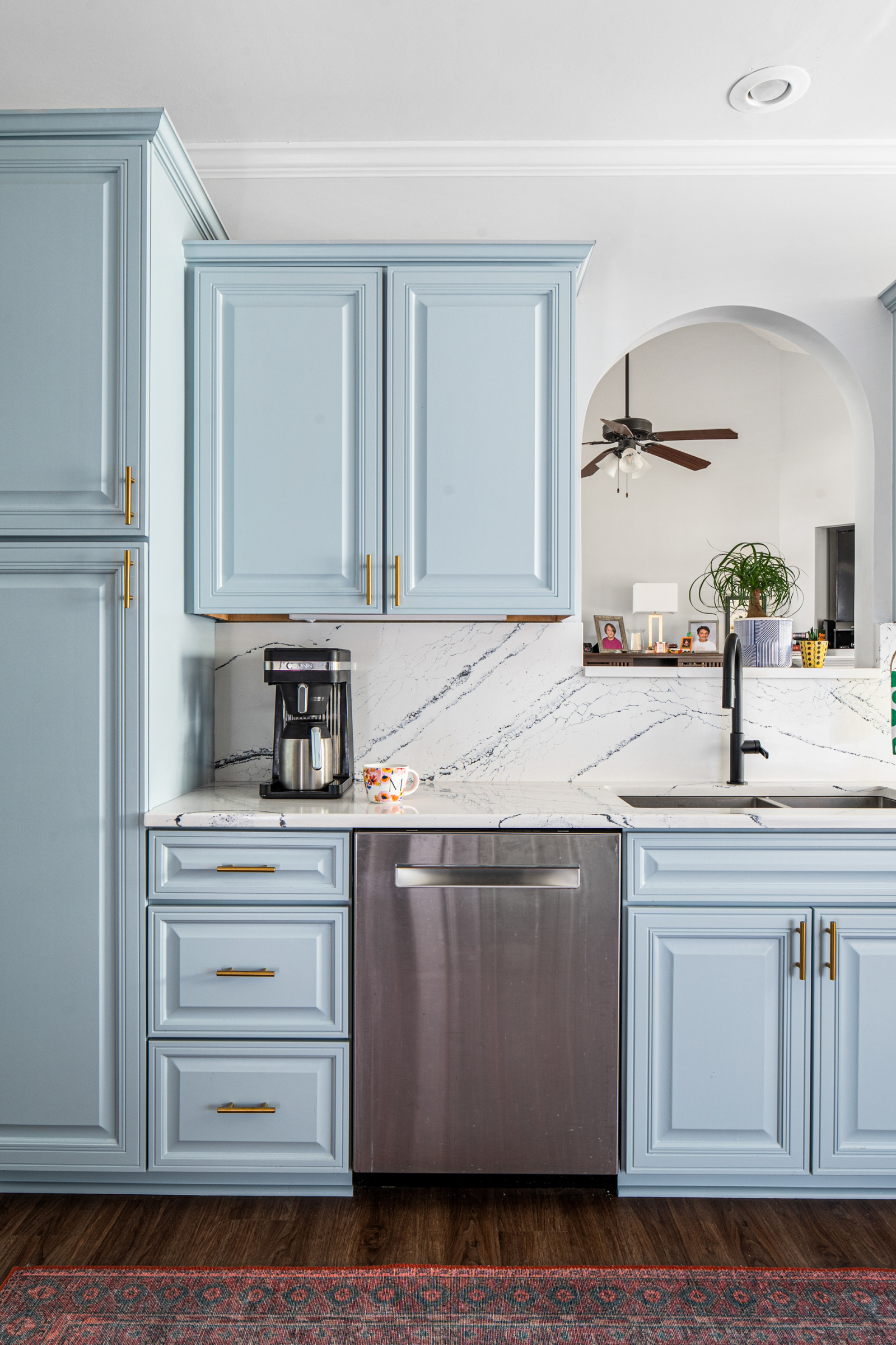 Stardew blue kitchen with quartz countertops designed by Atlanta luxury designer Lesley Myrick Interior Design.