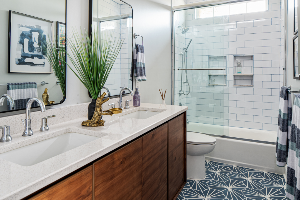 Blue and white bathroom remodel with subway tiles