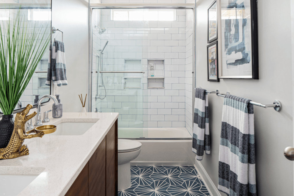 Mid-century wood vanity in a teenage boys' blue and white bathroom remodel