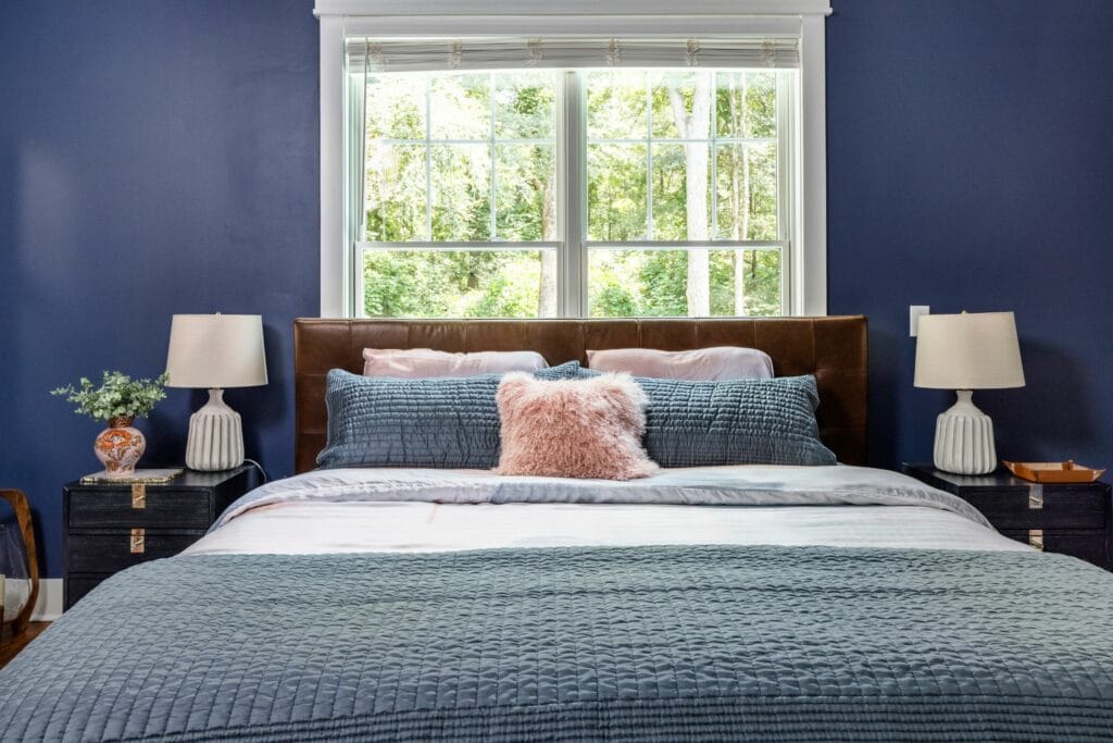 Navy blue farmhouse bedroom full-service interior design project by Lesley Myrick Interior Design in Macon, GA