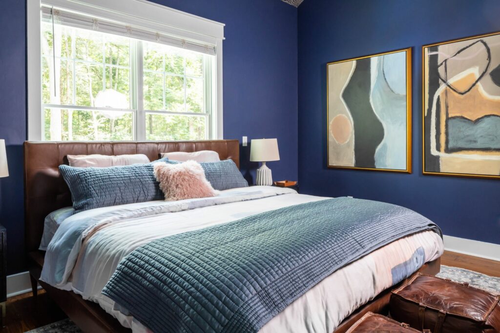 Navy blue farmhouse bedroom full-service interior design project by Lesley Myrick Interior Design in Macon, GA