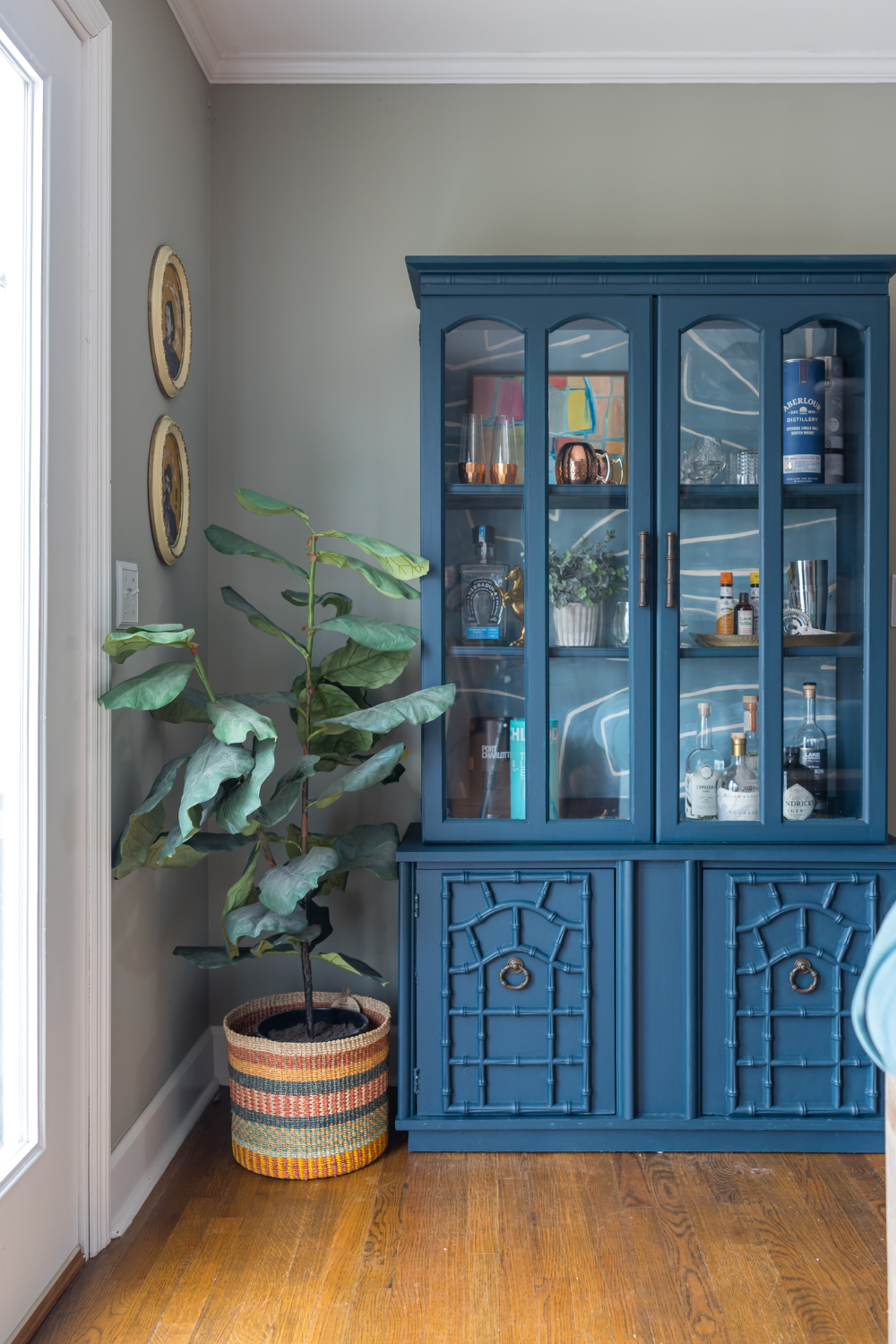 Vintage blue bar cabinet by Lesley Myrick interior design