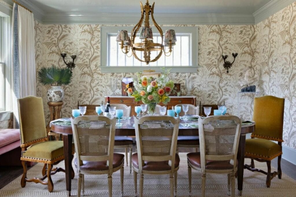 A traditional dining room centered around antiques by Courtney Moss Design.