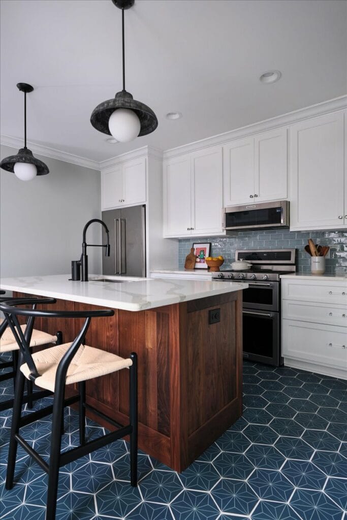 White shaker cabinets with a walnut wood island in a modern kitchen by Macon designer Lesley Myrick.
