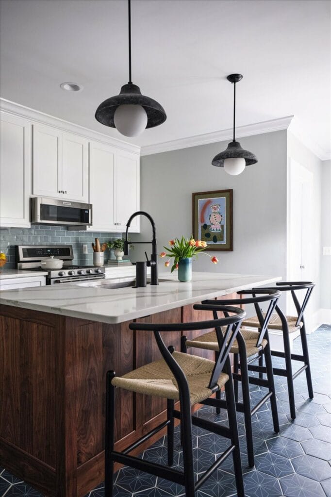 White shaker cabinets with a walnut wood island in a modern kitchen by Macon designer Lesley Myrick.