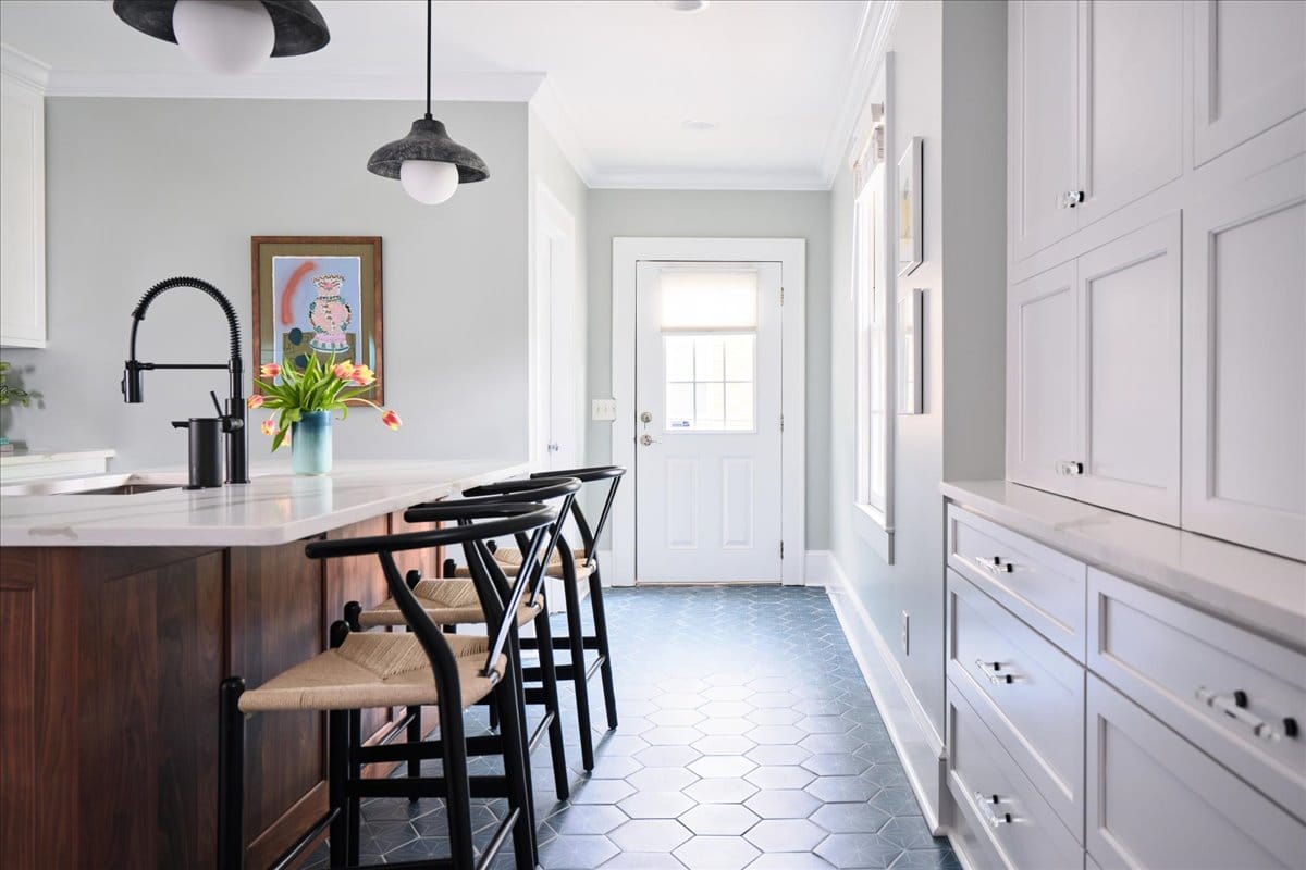 The bright and airy kitchen of a modern Macon bungalow redesigned by Lesley Myrick Interior Design - for people who don't do boring.