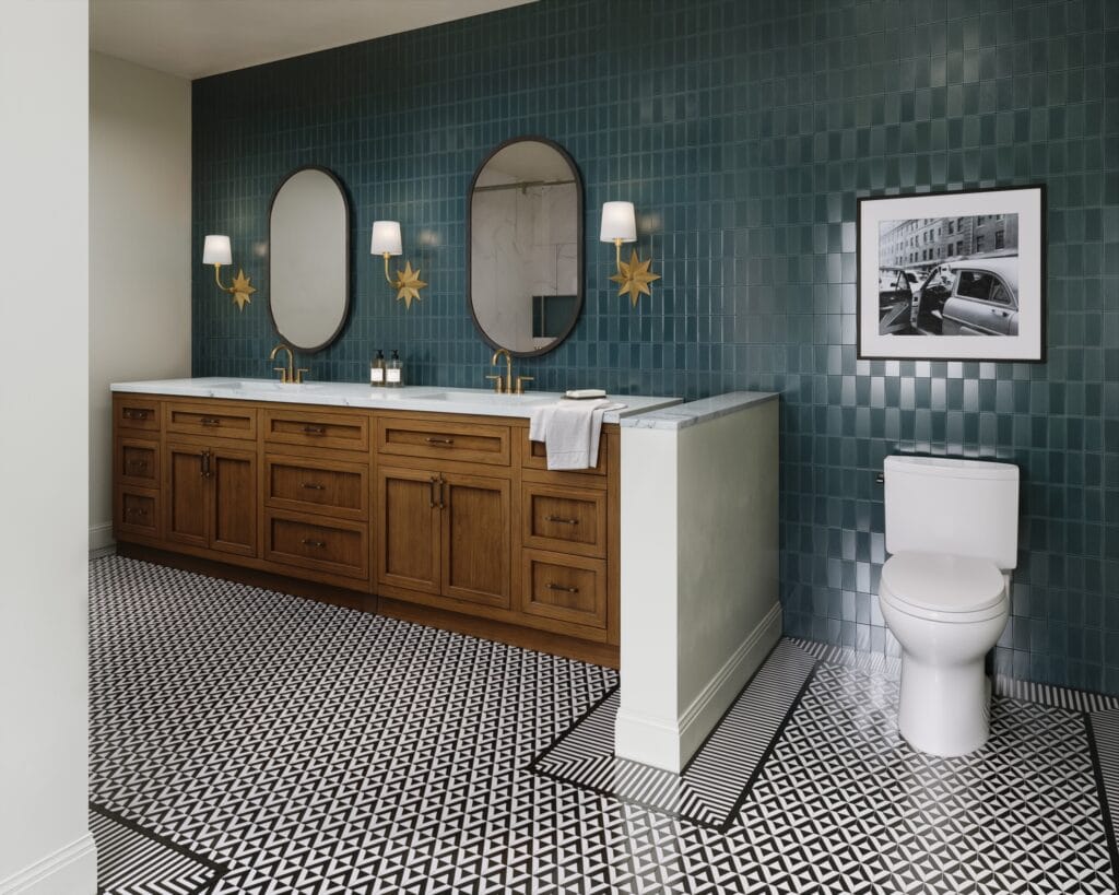 Design rendering of a primary bathroom floor in black-and-white triangle mosaic tile with a border